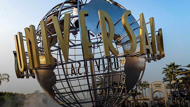 Universal Studios Hollywood globe with fountain and entrance area on a sunny day.